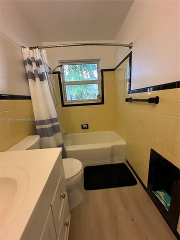 a bathroom with a sink a toilet and a bathtub