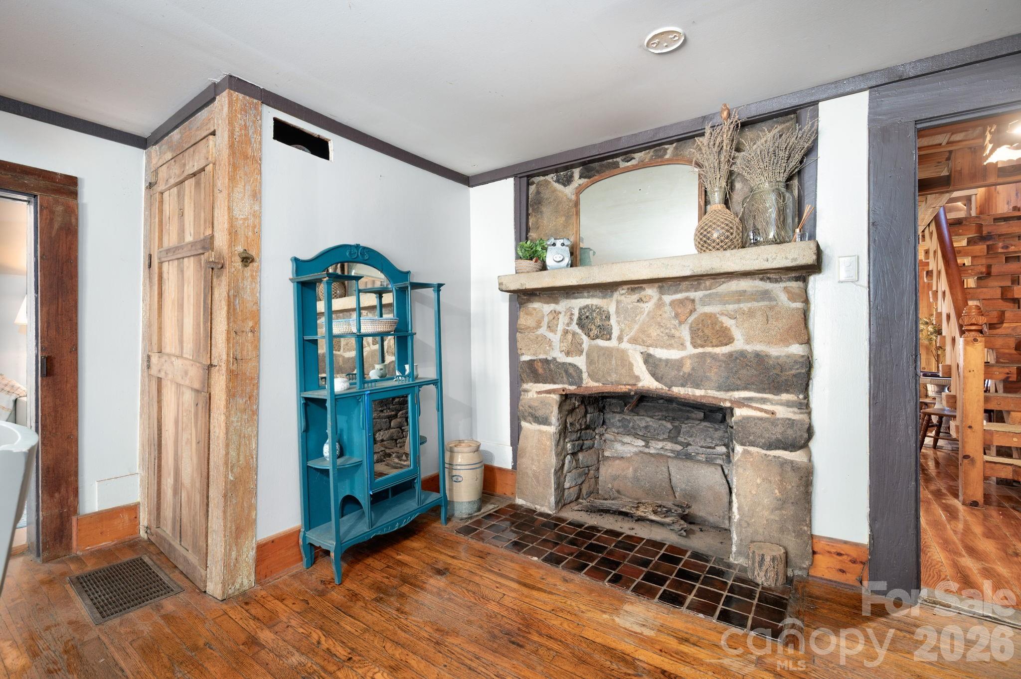 1265 Dillingham Road Barnardsville, NC 28709 - Photo 15 of 46 a living room with fireplace furniture and a window