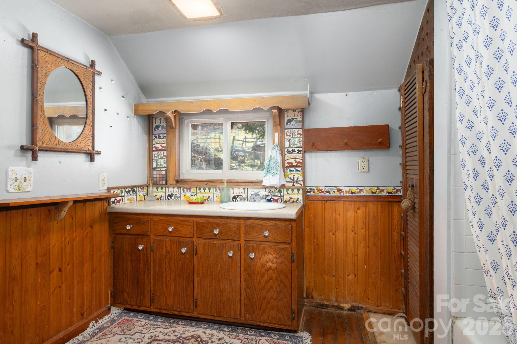 1265 Dillingham Road Barnardsville, NC 28709 - Photo 18 of 46 a room with a window and a sink
