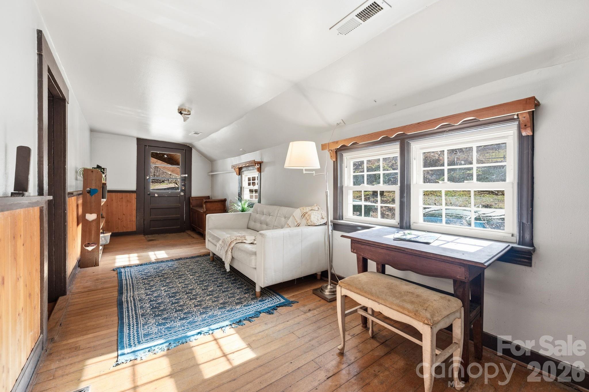1265 Dillingham Road Barnardsville, NC 28709 - Photo 20 of 46 a living room with furniture and a large window