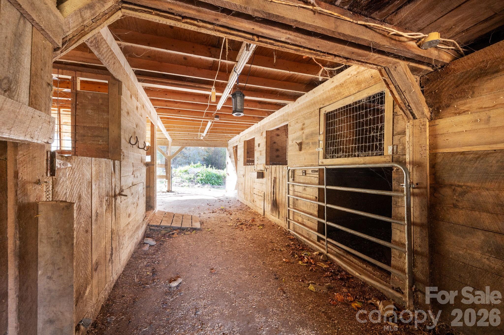 1265 Dillingham Road Barnardsville, NC 28709 - Photo 34 of 46 a view of deck with wooden floor and floor to ceiling window