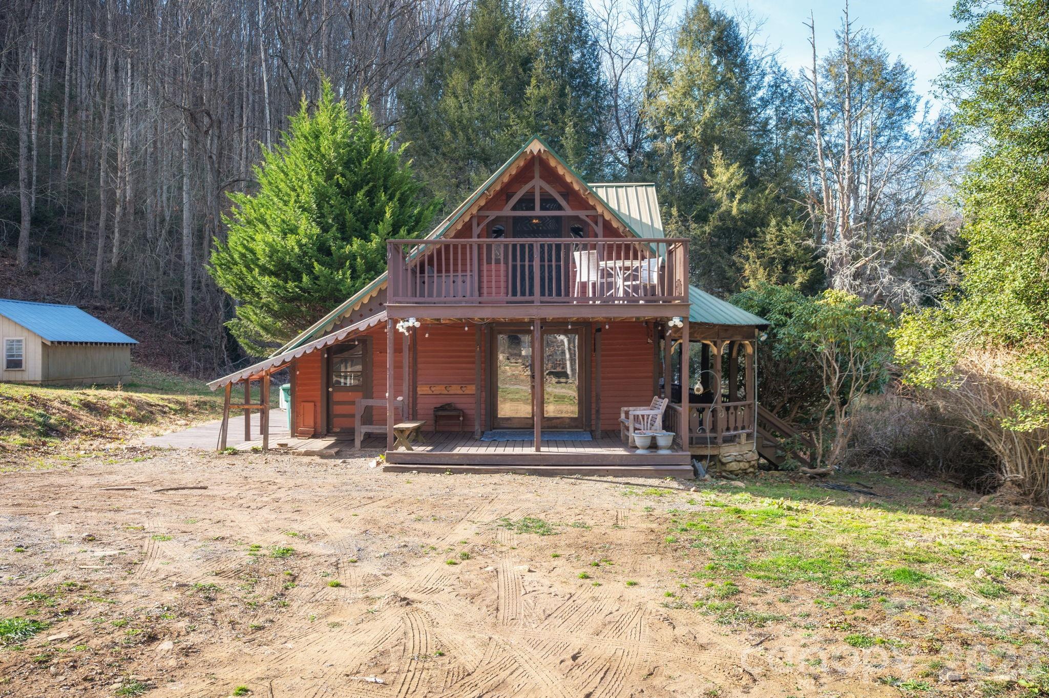 1265 Dillingham Road Barnardsville, NC 28709 - Photo 44 of 46 a front view of a house with a yard