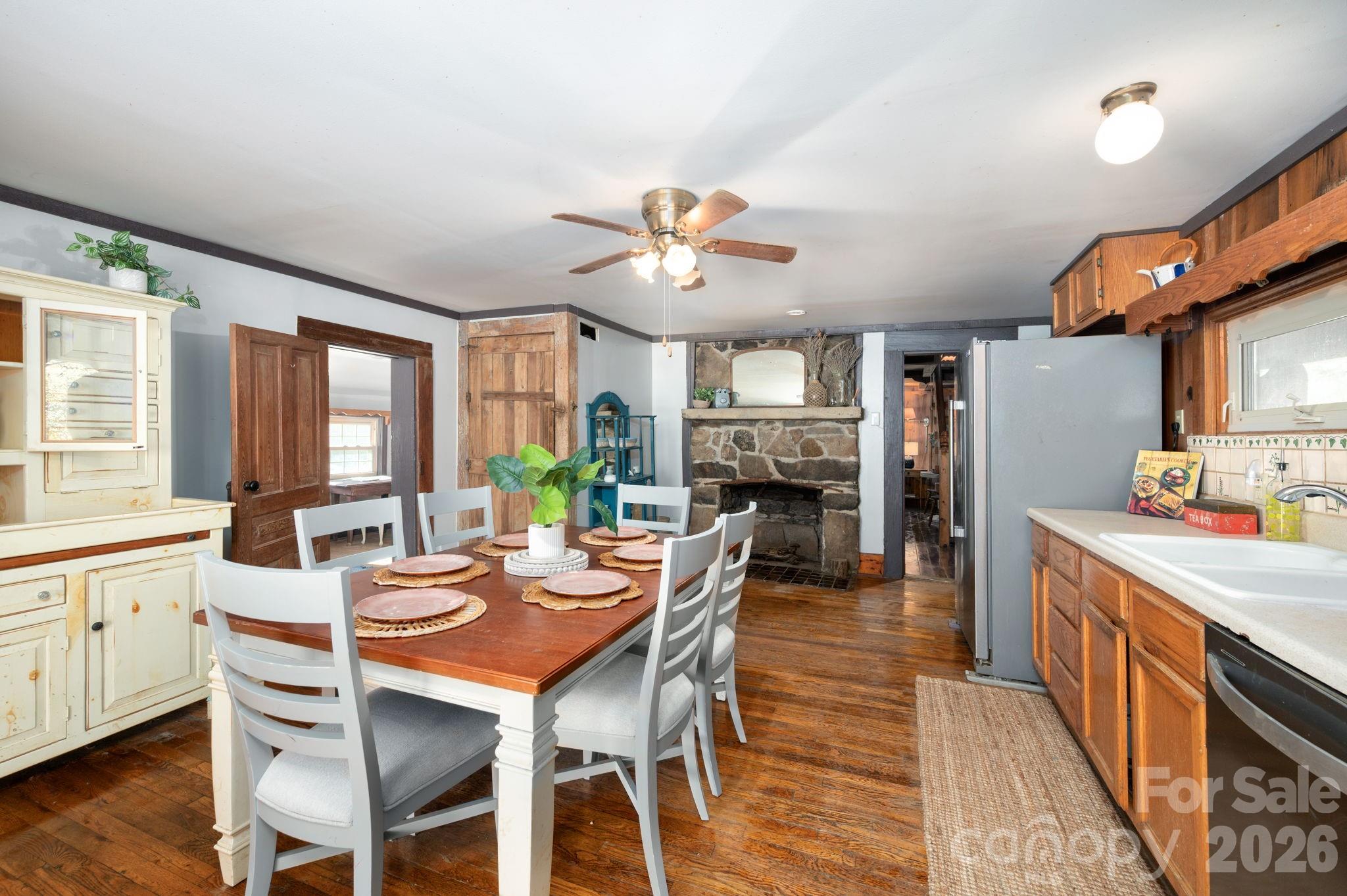 1265 Dillingham Road Barnardsville, NC 28709 - Photo 10 of 46 a view of a dining room with furniture and a chandelier