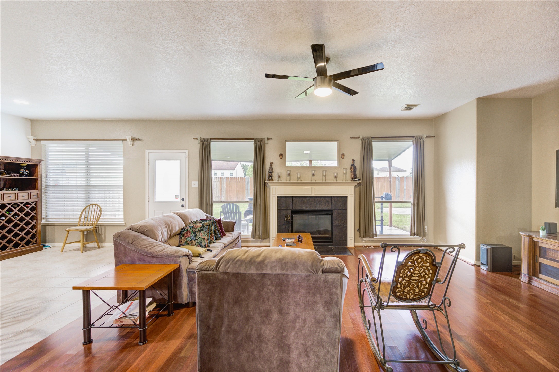 16730 Spring Barker Drive Cypress, TX 77429 - Photo 11 of 50 a living room with furniture and a fireplace