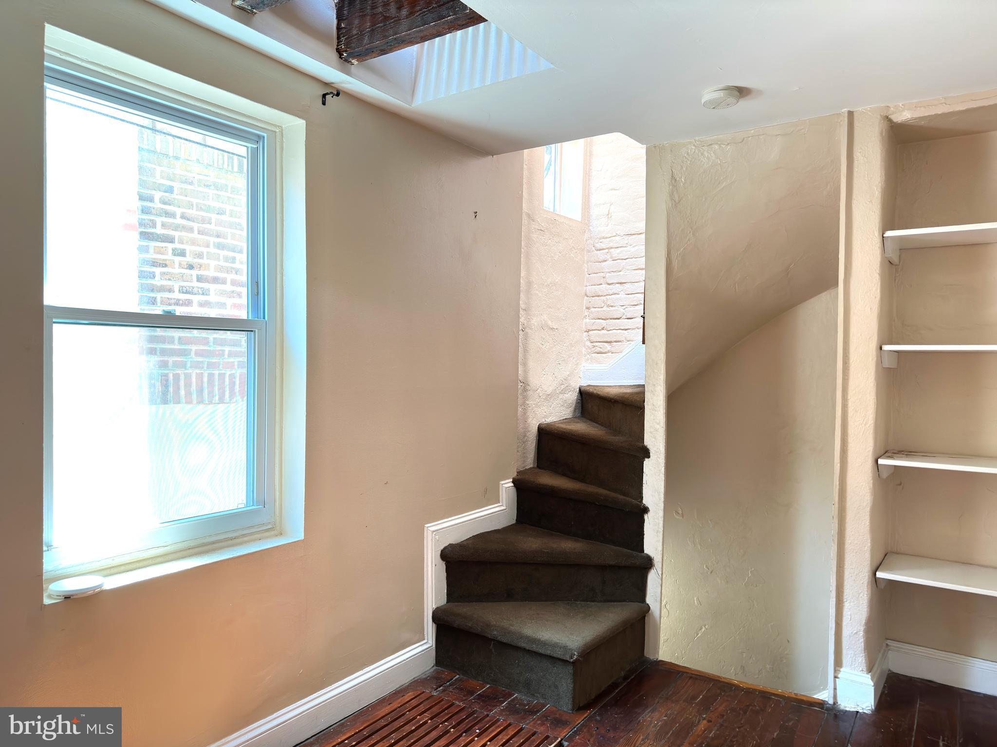 623 South American Street, Unit F Philadelphia, PA 19147 - Photo 11 of 38 a view of entryway with wooden floor and stairs