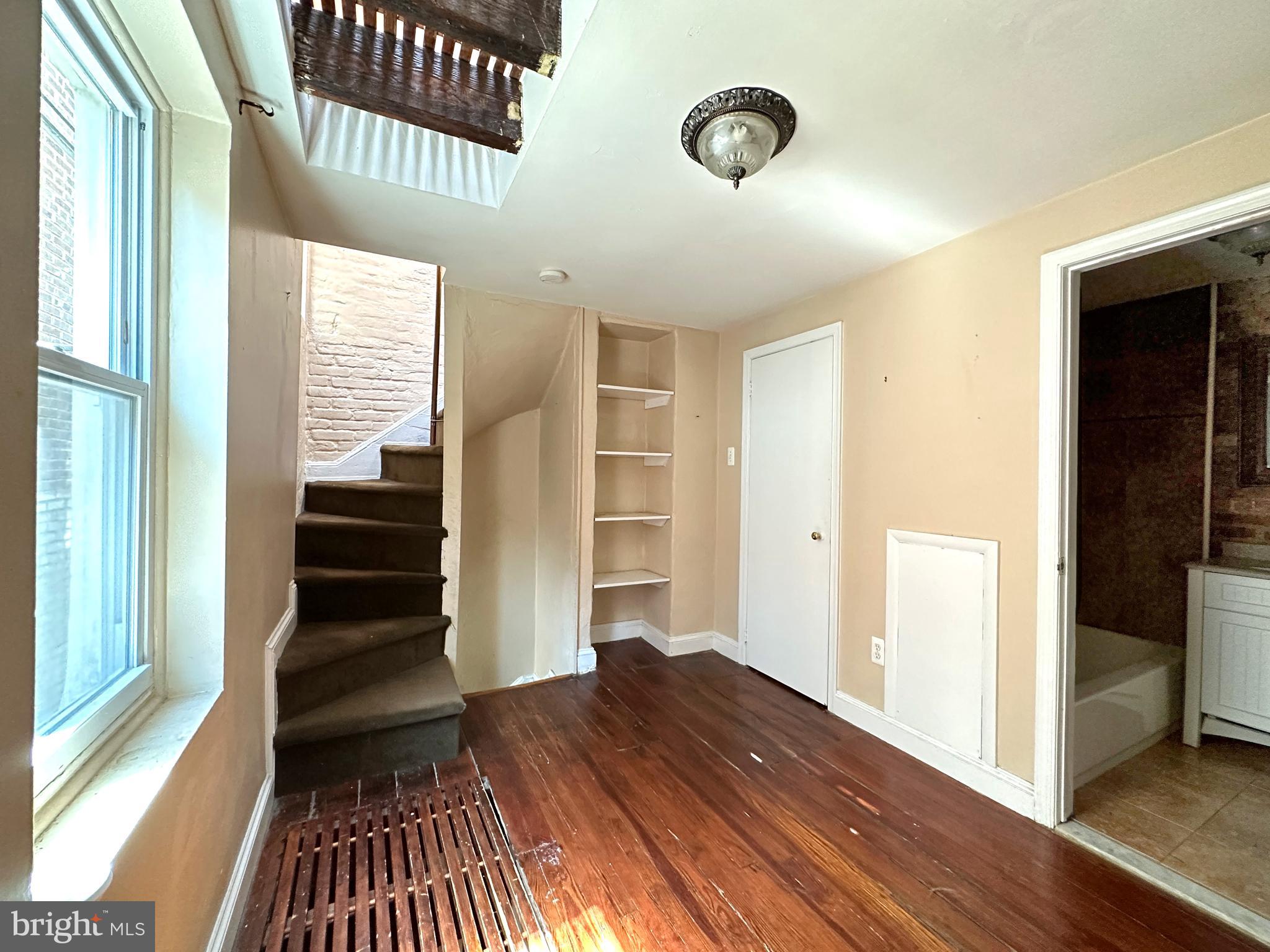 623 South American Street, Unit F Philadelphia, PA 19147 - Photo 17 of 38 a view of a hallway view with wooden floor and staircase