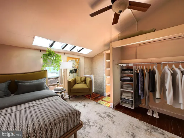 a bedroom with furniture and a window