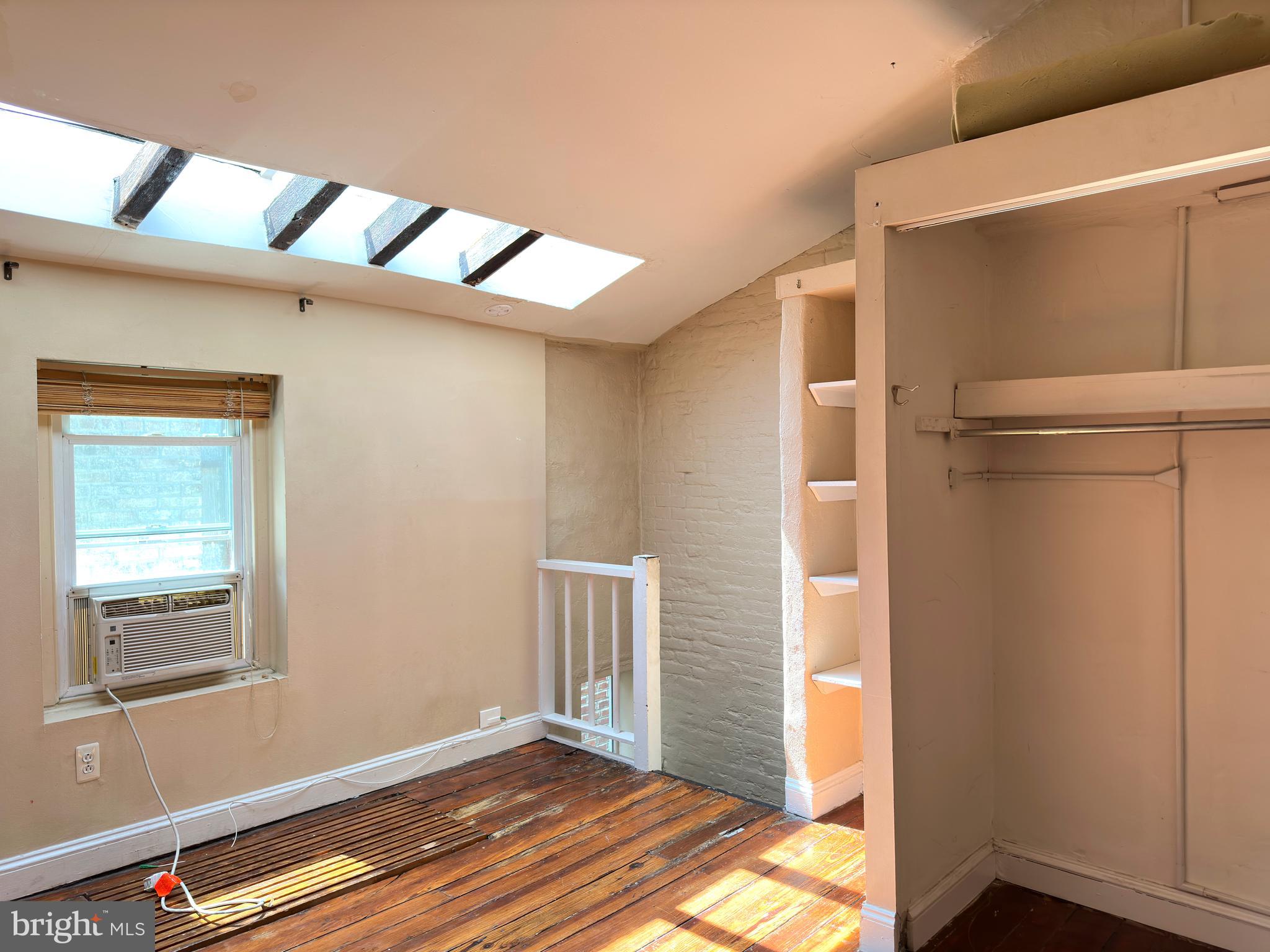 623 South American Street, Unit F Philadelphia, PA 19147 - Photo 23 of 38 a view of an empty room with closet and a window