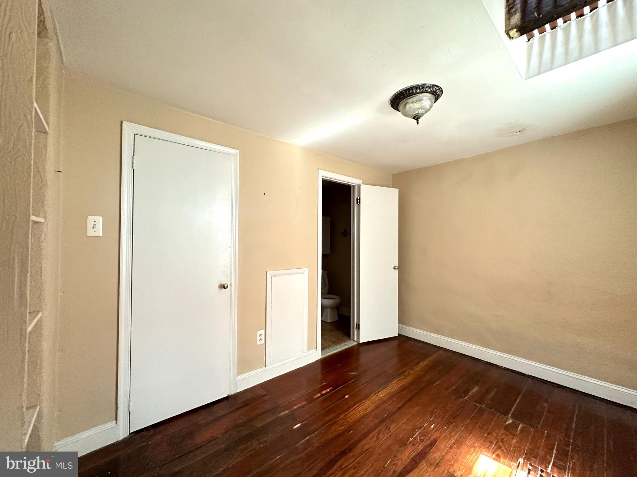 623 South American Street, Unit F Philadelphia, PA 19147 - Photo 26 of 38 an empty room with wooden floor and windows