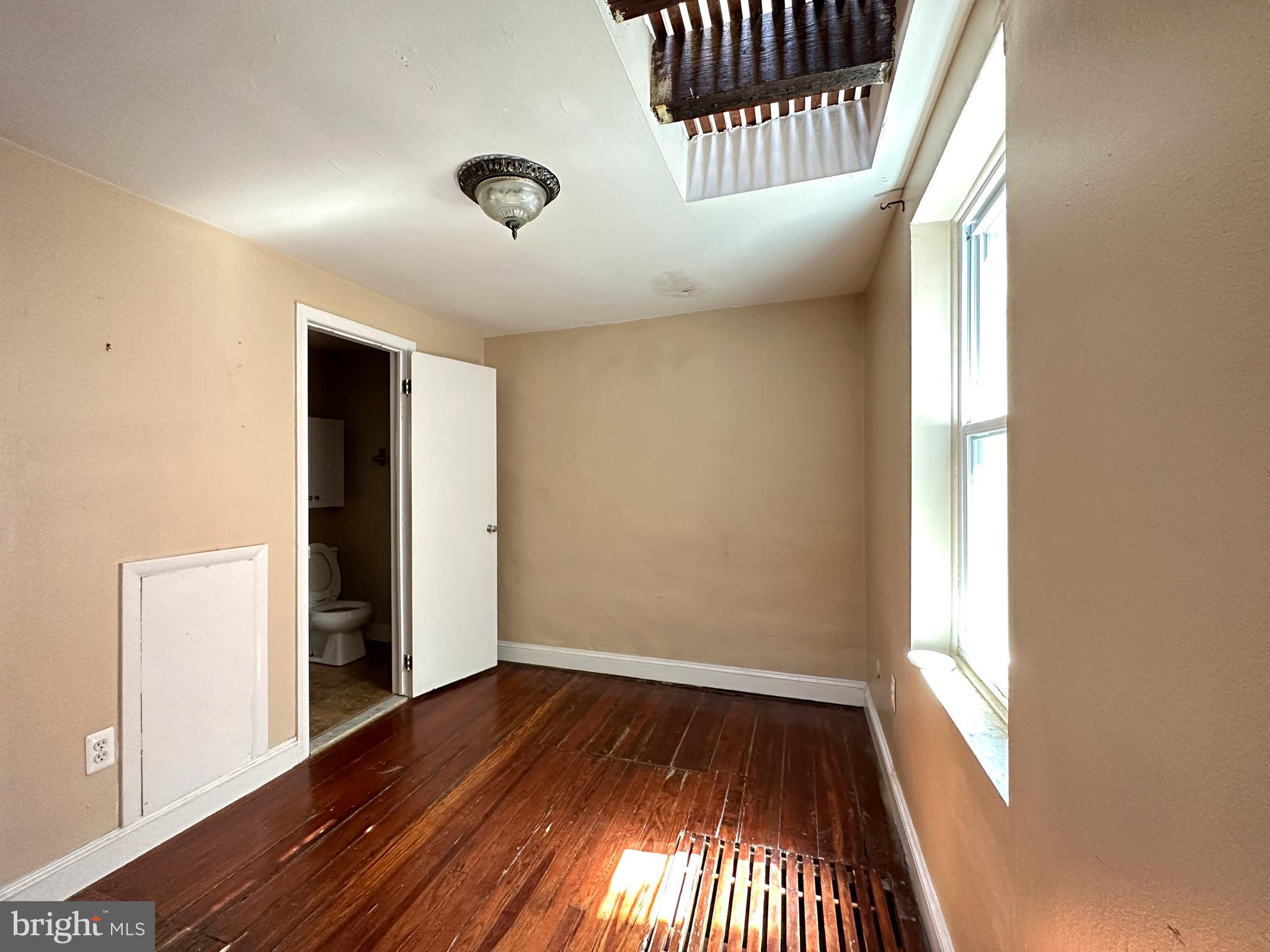 623 South American Street, Unit F Philadelphia, PA 19147 - Photo 27 of 38 wooden floor in an empty room with a window