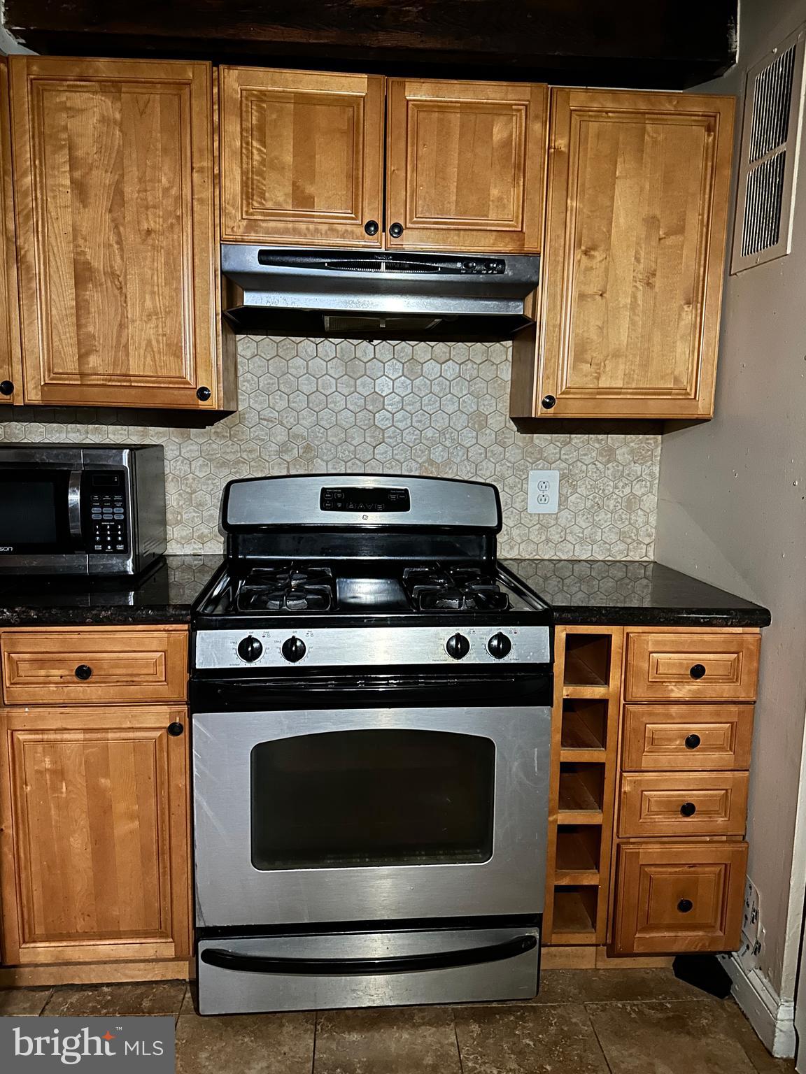 623 South American Street, Unit F Philadelphia, PA 19147 - Photo 33 of 38 a stove top oven sitting inside of a kitchen