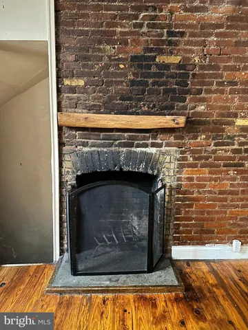 a bathroom with a toilet a sink and a mirror