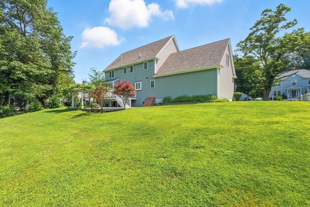 30 Neponset Street Walpole, MA 02071 - Photo 6 of 41 a view of a house with a yard and garage