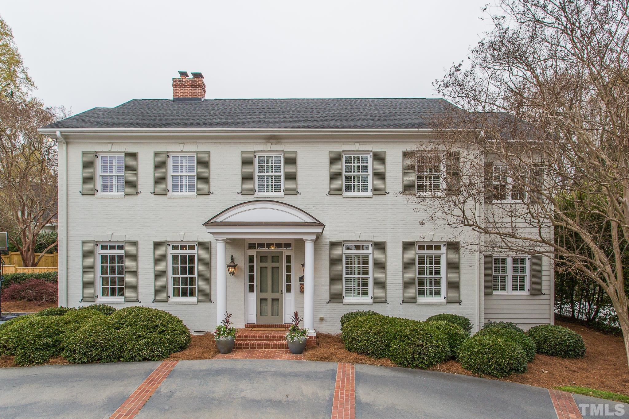 2505 Anderson Drive Raleigh, NC 27608 - Photo 1 of 30 a front view of a brick house with a yard