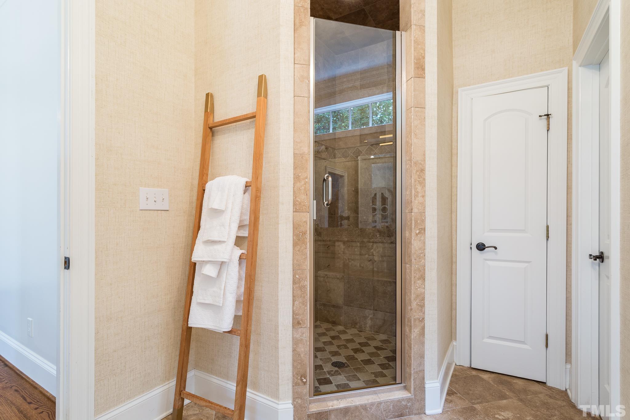 2505 Anderson Drive Raleigh, NC 27608 - Photo 14 of 30 a bathroom with a glass shower door