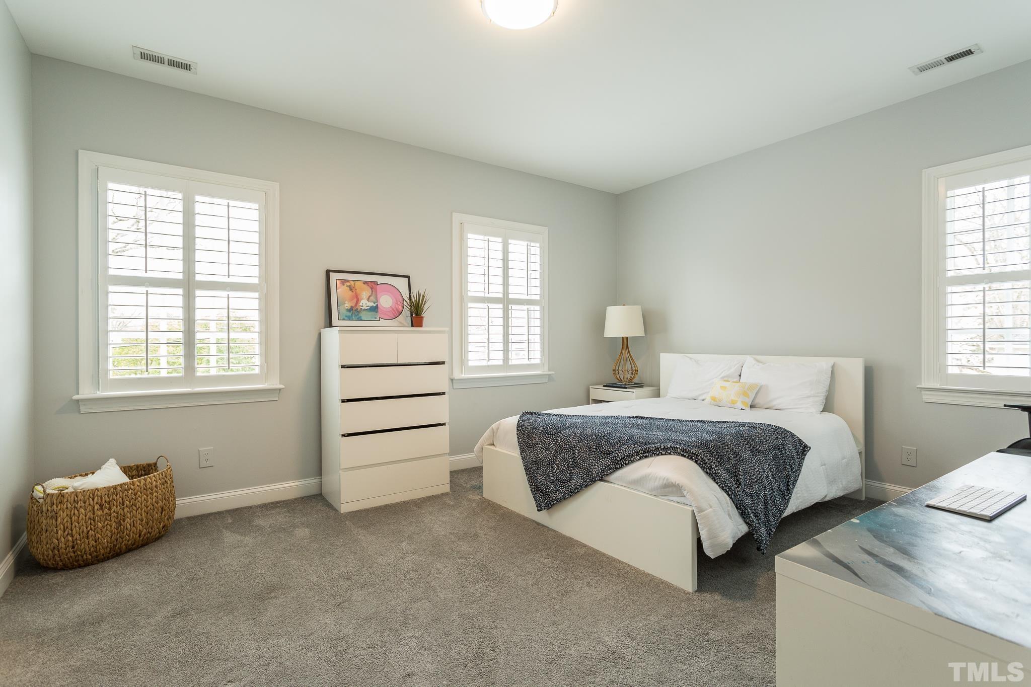 2505 Anderson Drive Raleigh, NC 27608 - Photo 17 of 30 a spacious bedroom with a bed and a window