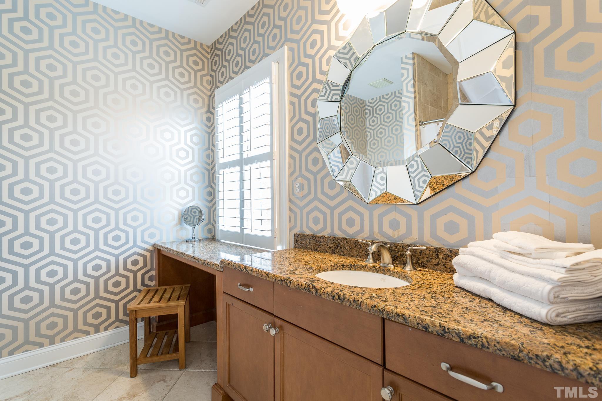 2505 Anderson Drive Raleigh, NC 27608 - Photo 18 of 30 a bathroom with a sink mirror and vanity