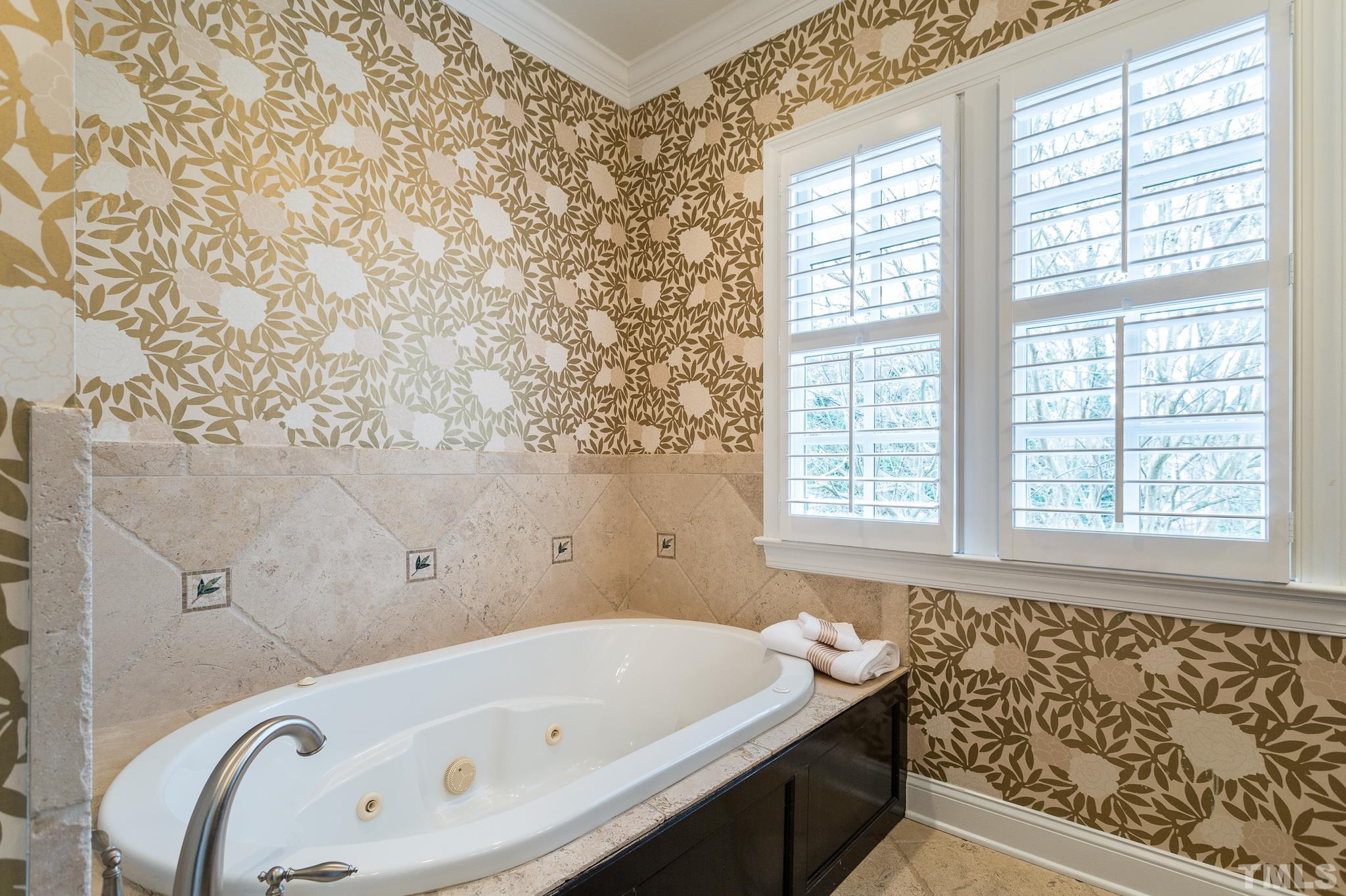 2505 Anderson Drive Raleigh, NC 27608 - Photo 23 of 30 a bathroom with a bathtub and window