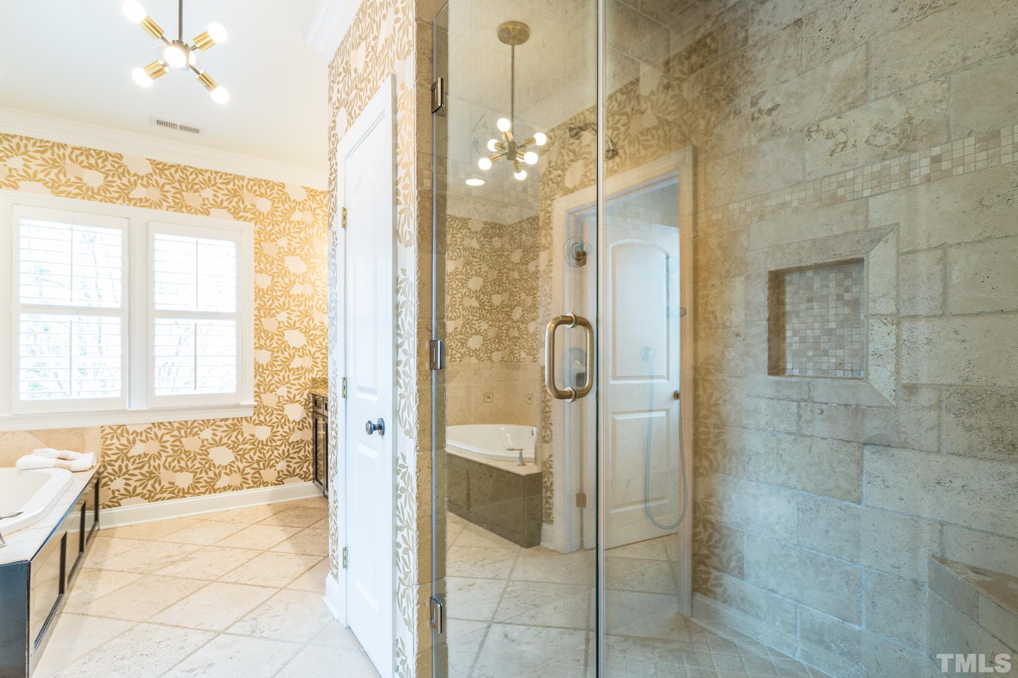 2505 Anderson Drive Raleigh, NC 27608 - Photo 24 of 30 a bathroom with a glass shower door and a shower
