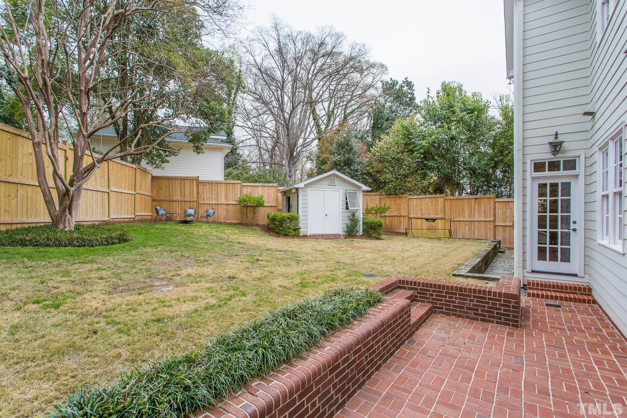 2505 Anderson Drive Raleigh, NC 27608 - Photo 27 of 30 a view of a backyard with a small cabin
