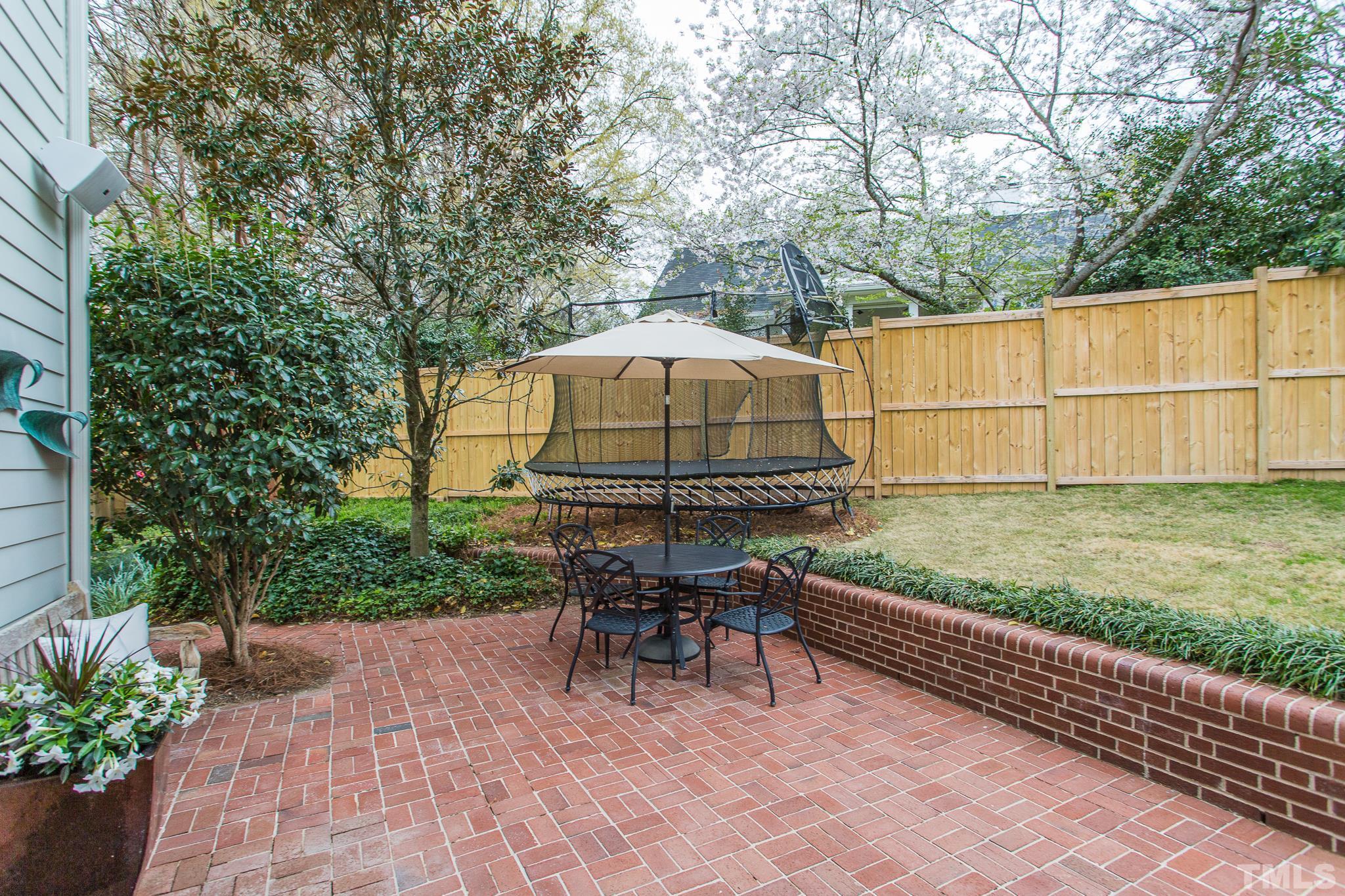 2505 Anderson Drive Raleigh, NC 27608 - Photo 29 of 30 a backyard of a house with table and chairs