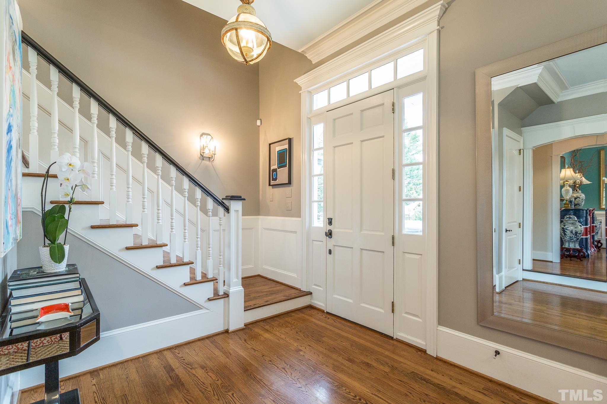 2505 Anderson Drive Raleigh, NC 27608 - Photo 3 of 30 a view of entryway with wooden floor and stairs