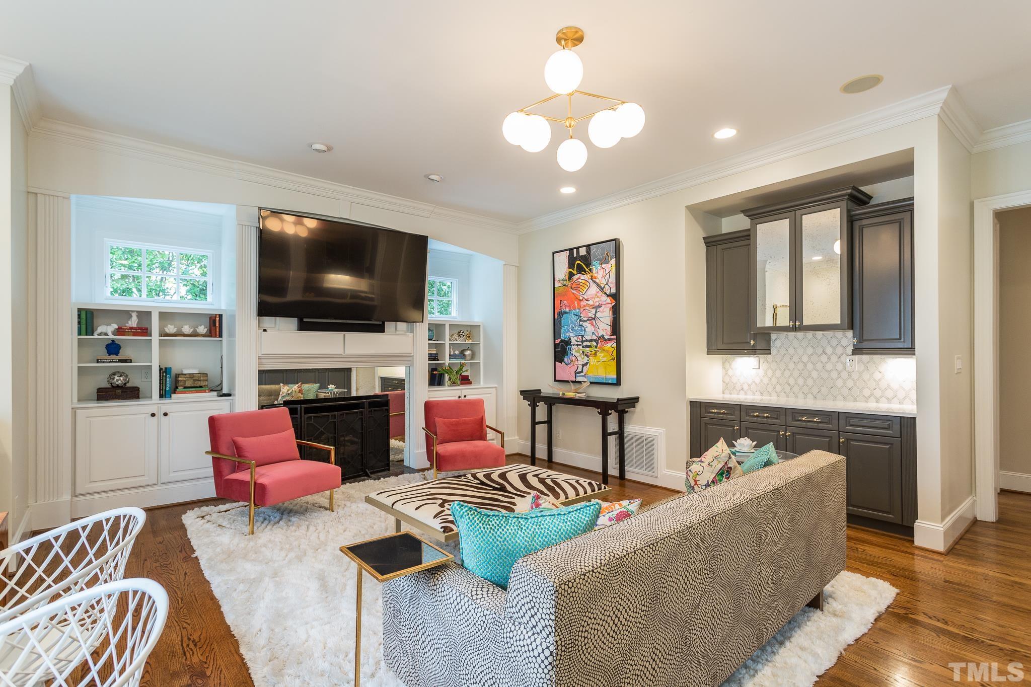 2505 Anderson Drive Raleigh, NC 27608 - Photo 6 of 30 a living room with fireplace furniture and a flat screen tv