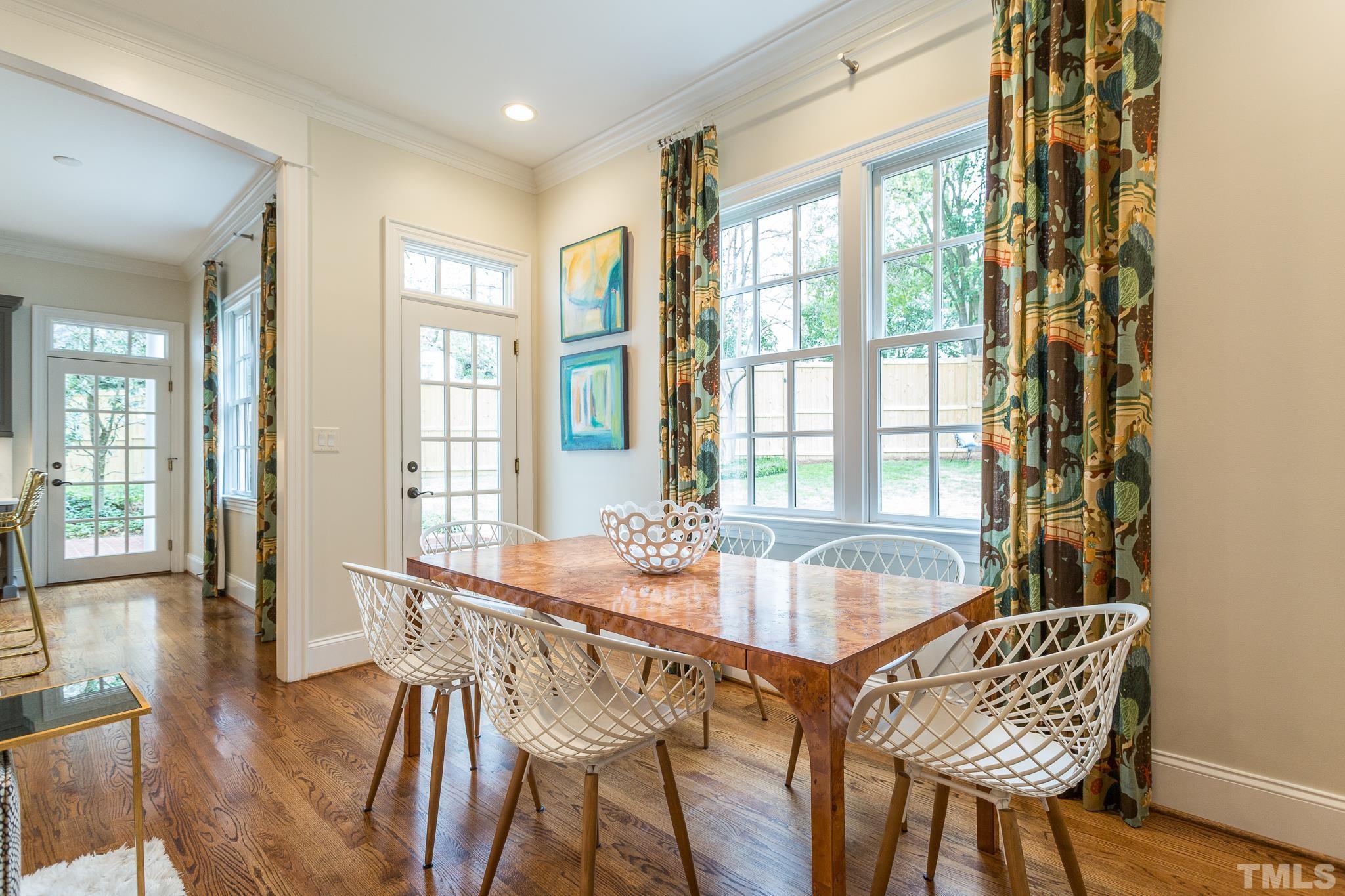 2505 Anderson Drive Raleigh, NC 27608 - Photo 8 of 30 a dining room with furniture and wooden floor