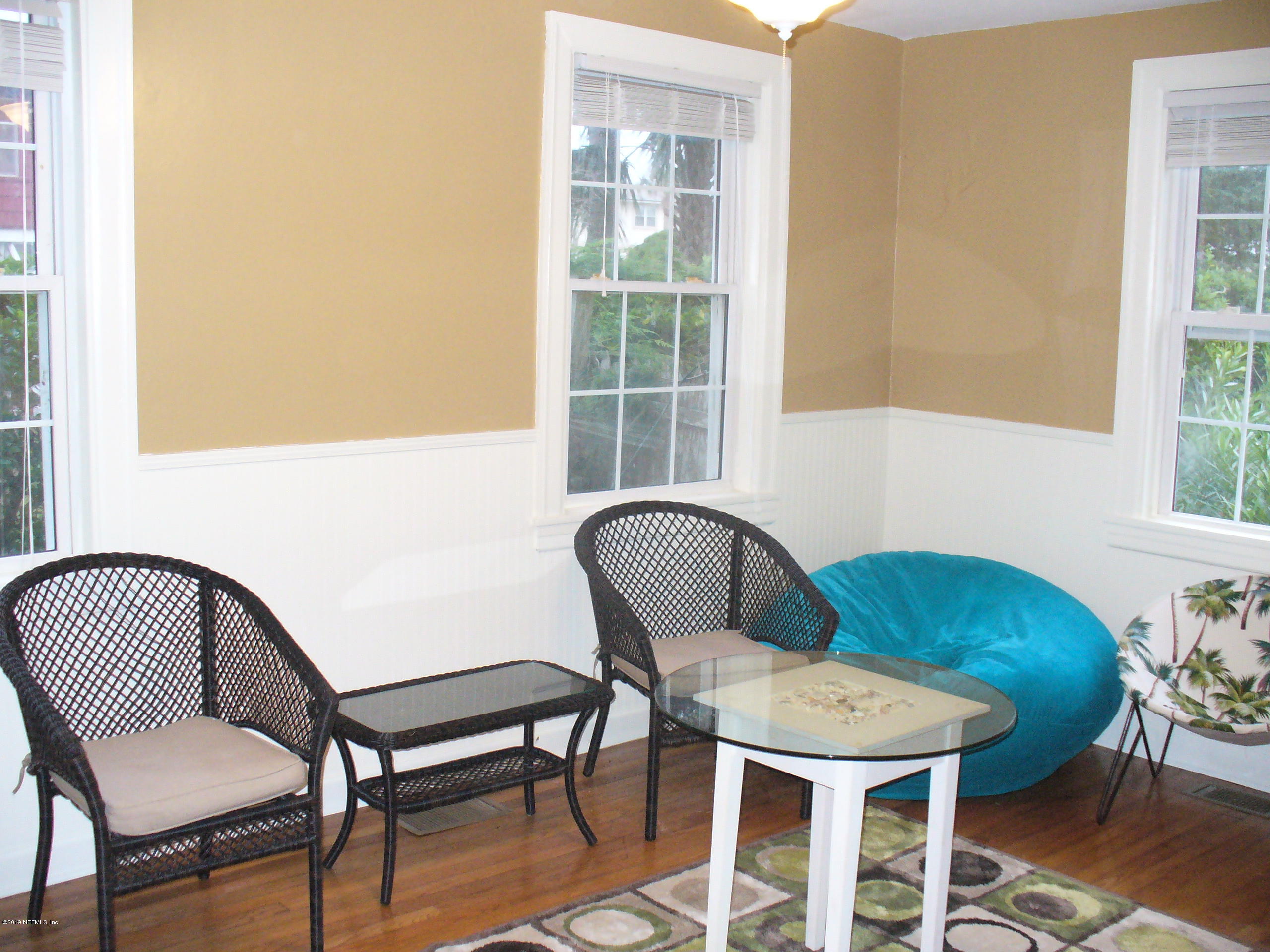 212 Oak Street Neptune Beach, FL 32266 - Photo 2 of 7 a view of a dining room with furniture and wooden floor