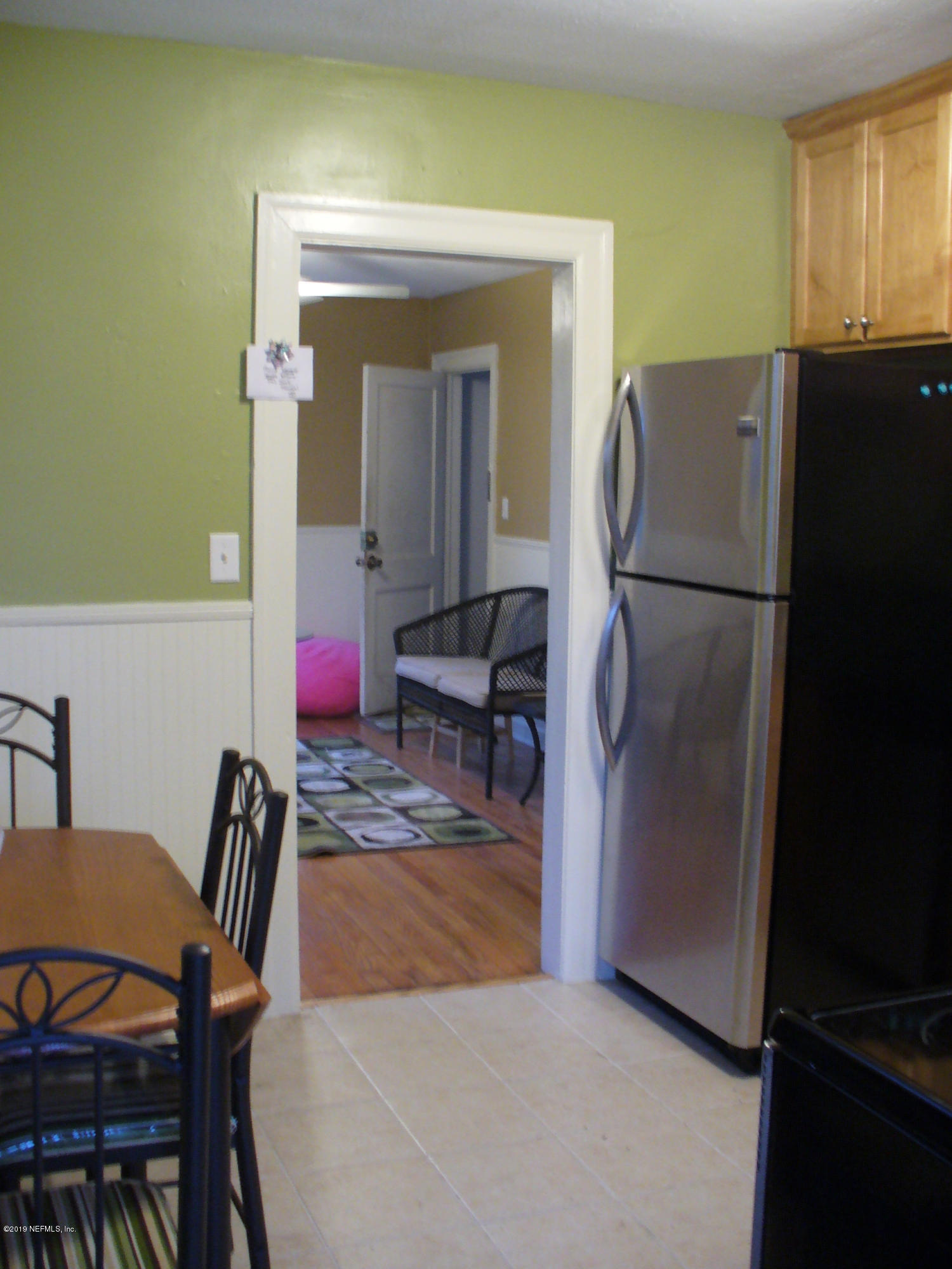 212 Oak Street Neptune Beach, FL 32266 - Photo 6 of 7 a view of kitchen with furniture and refrigerator
