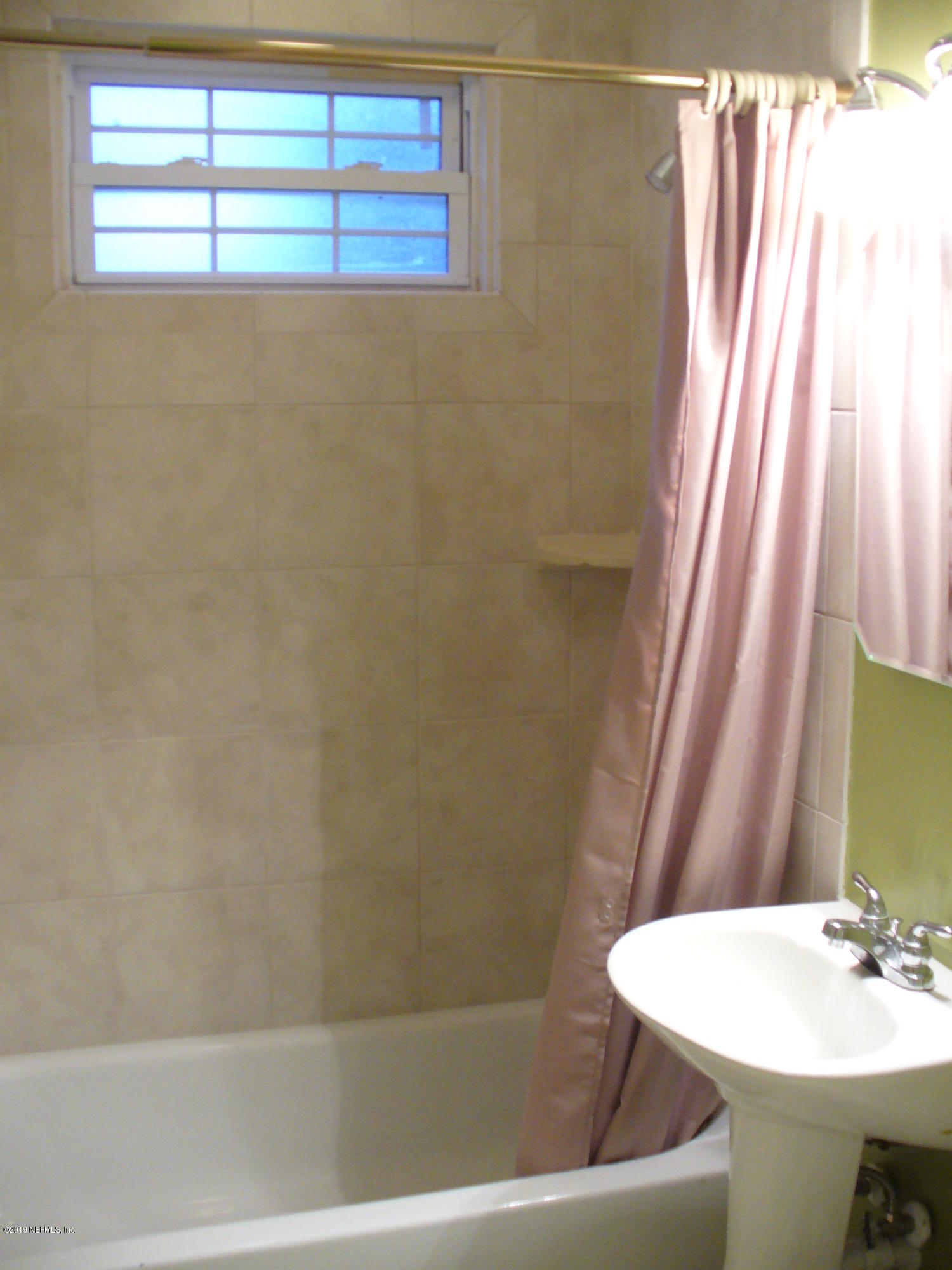 212 Oak Street Neptune Beach, FL 32266 - Photo 7 of 7 a bathroom with a sink and a bathtub