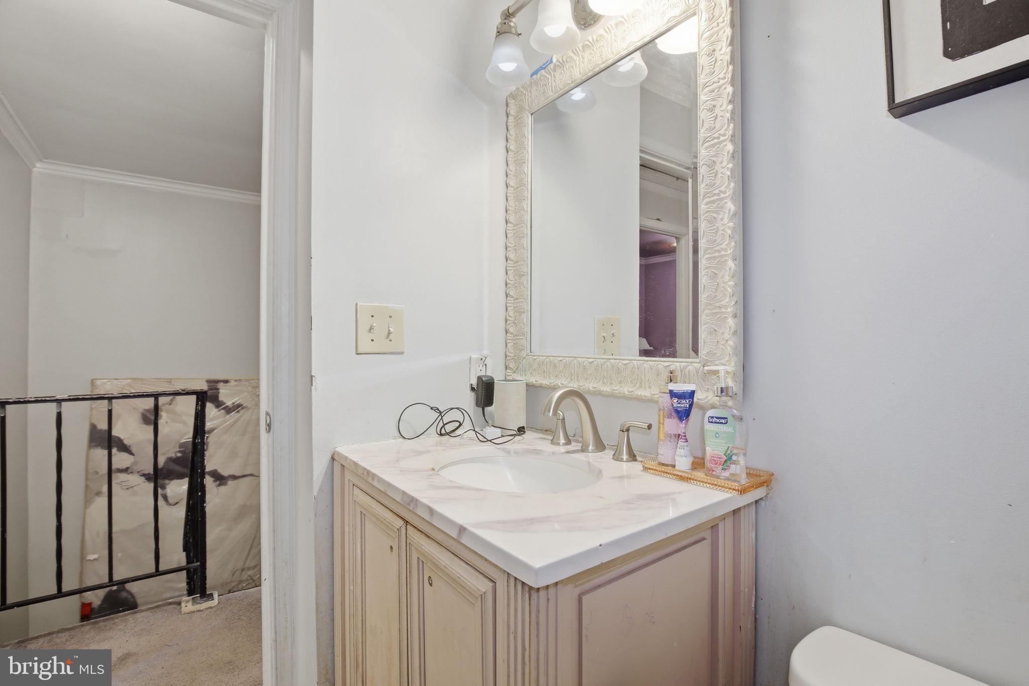 1101 Dutton Way Capitol Heights, MD 20743 - Photo 15 of 29 a bathroom with a sink and a mirror