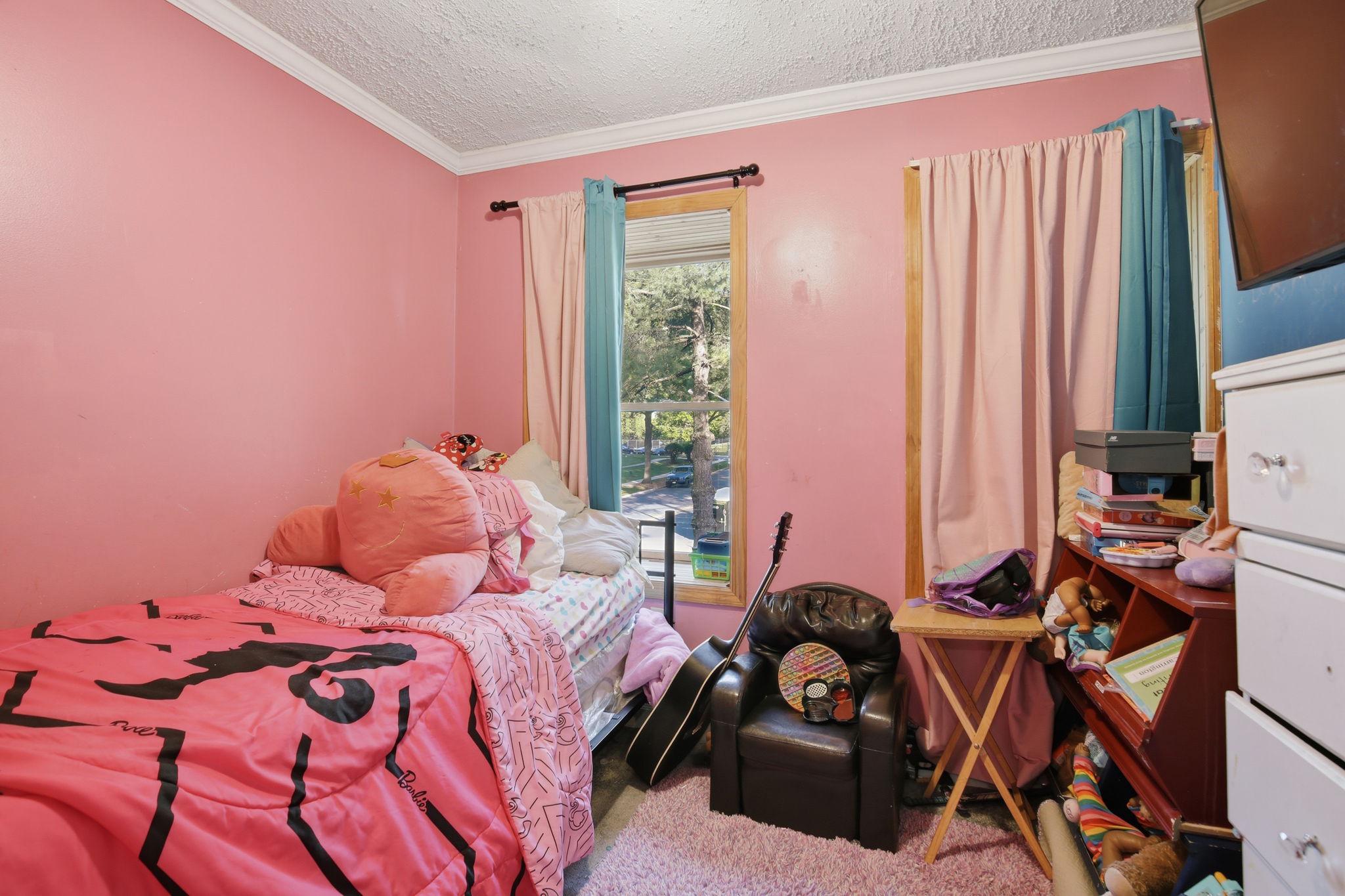 1101 Dutton Way Capitol Heights, MD 20743 - Photo 19 of 29 a bedroom with a bed and a window