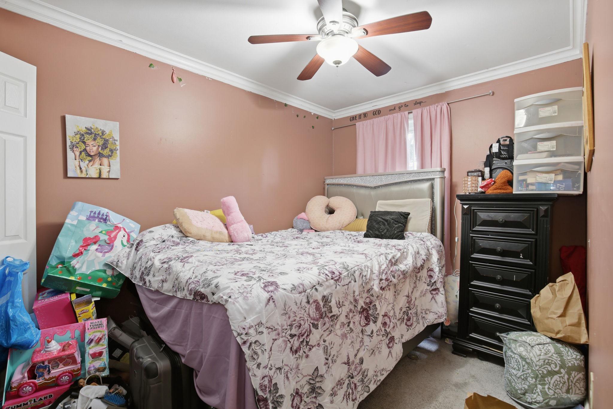 1101 Dutton Way Capitol Heights, MD 20743 - Photo 21 of 29 a bedroom with a bed and a window