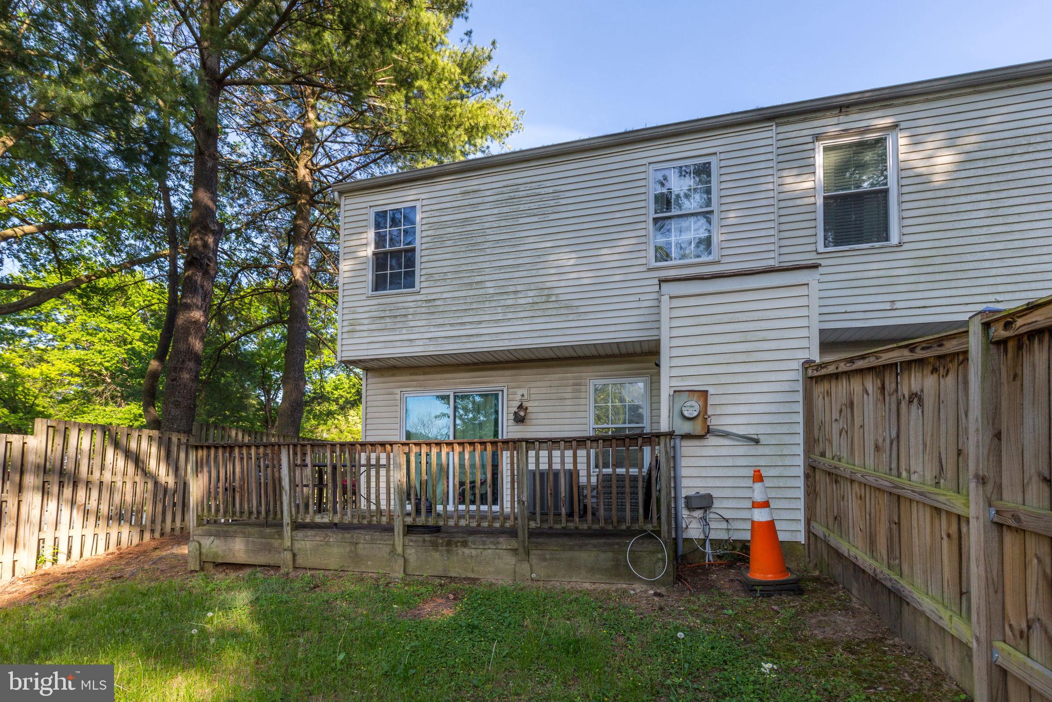 1101 Dutton Way Capitol Heights, MD 20743 - Photo 24 of 29 a view of a house with a small yard and wooden fence