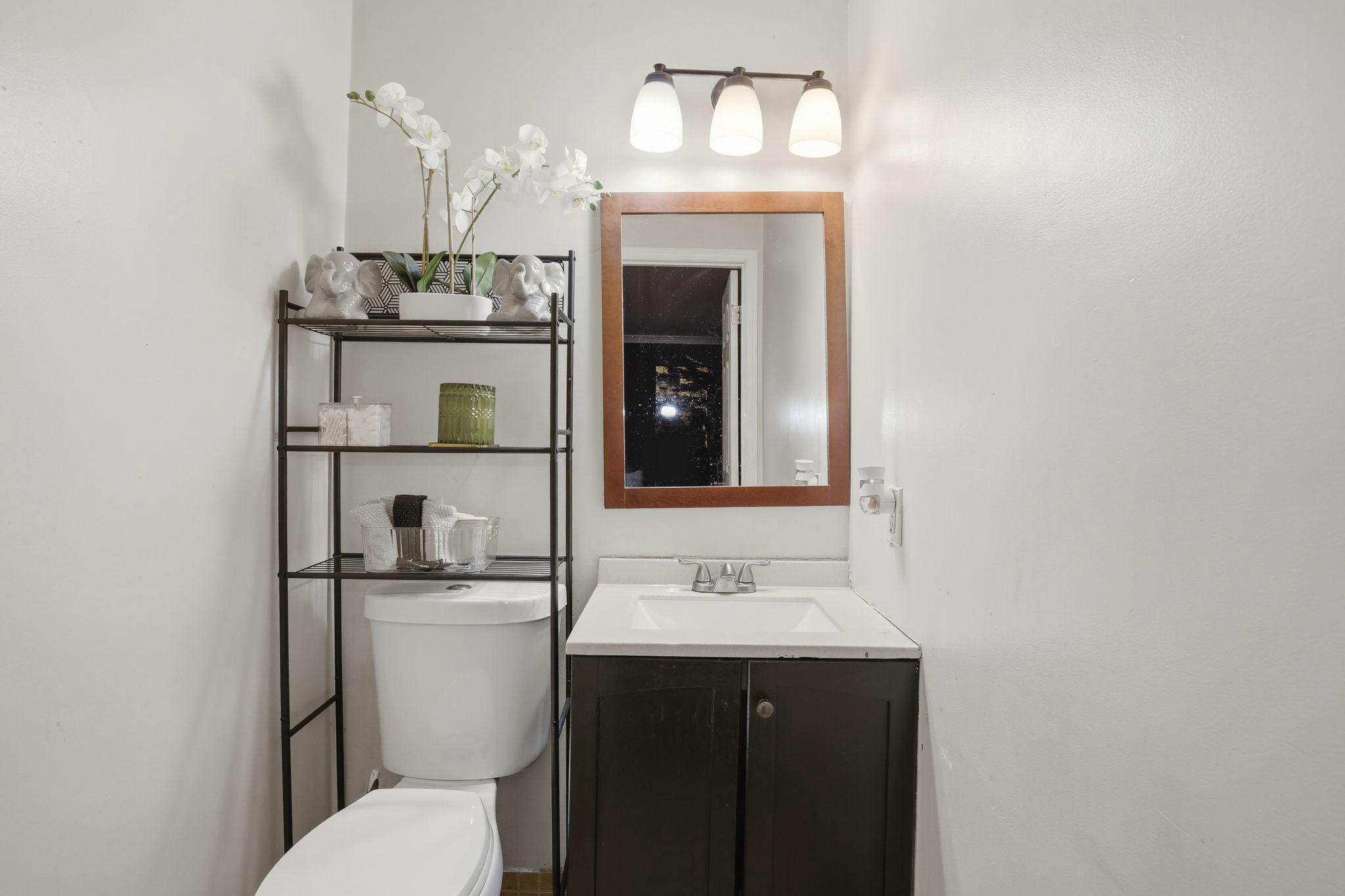 1101 Dutton Way Capitol Heights, MD 20743 - Photo 5 of 29 a bathroom with a toilet sink and mirror