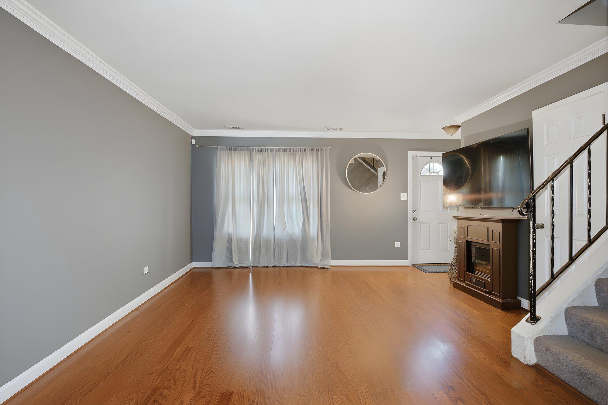 1101 Dutton Way Capitol Heights, MD 20743 - Photo 7 of 29 a view of empty room with wooden floor and fireplace