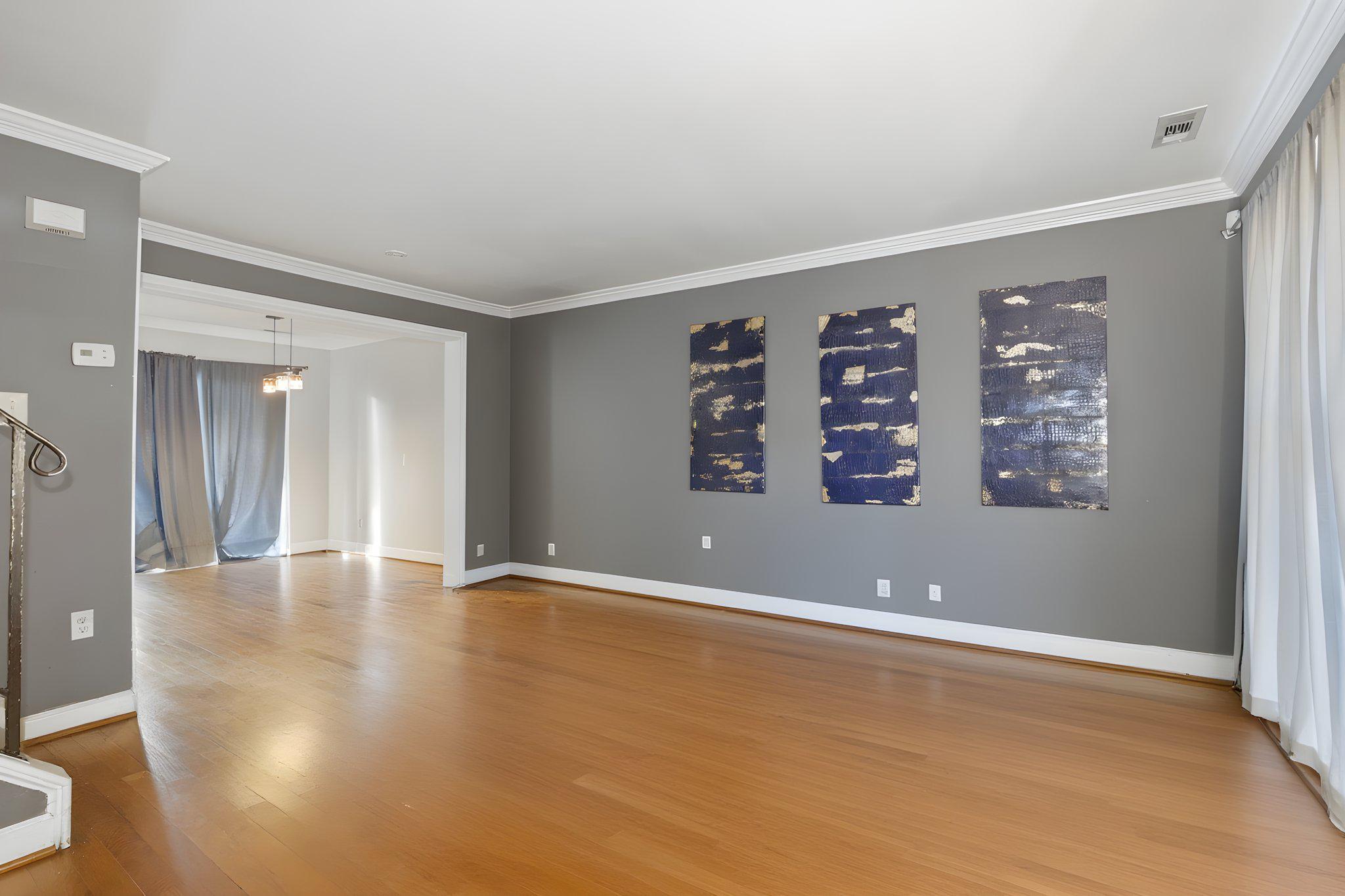 1101 Dutton Way Capitol Heights, MD 20743 - Photo 9 of 29 a view of an empty room with window and wooden floor
