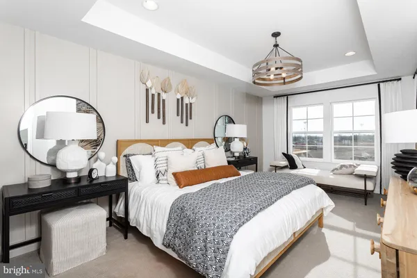 a bed room with a bed and a chandelier