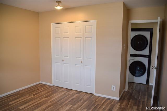 1225 South Oneida Street, Unit 252 Denver, CO 80224 - Photo 16 of 20 a view of a hallway with washer and dryer