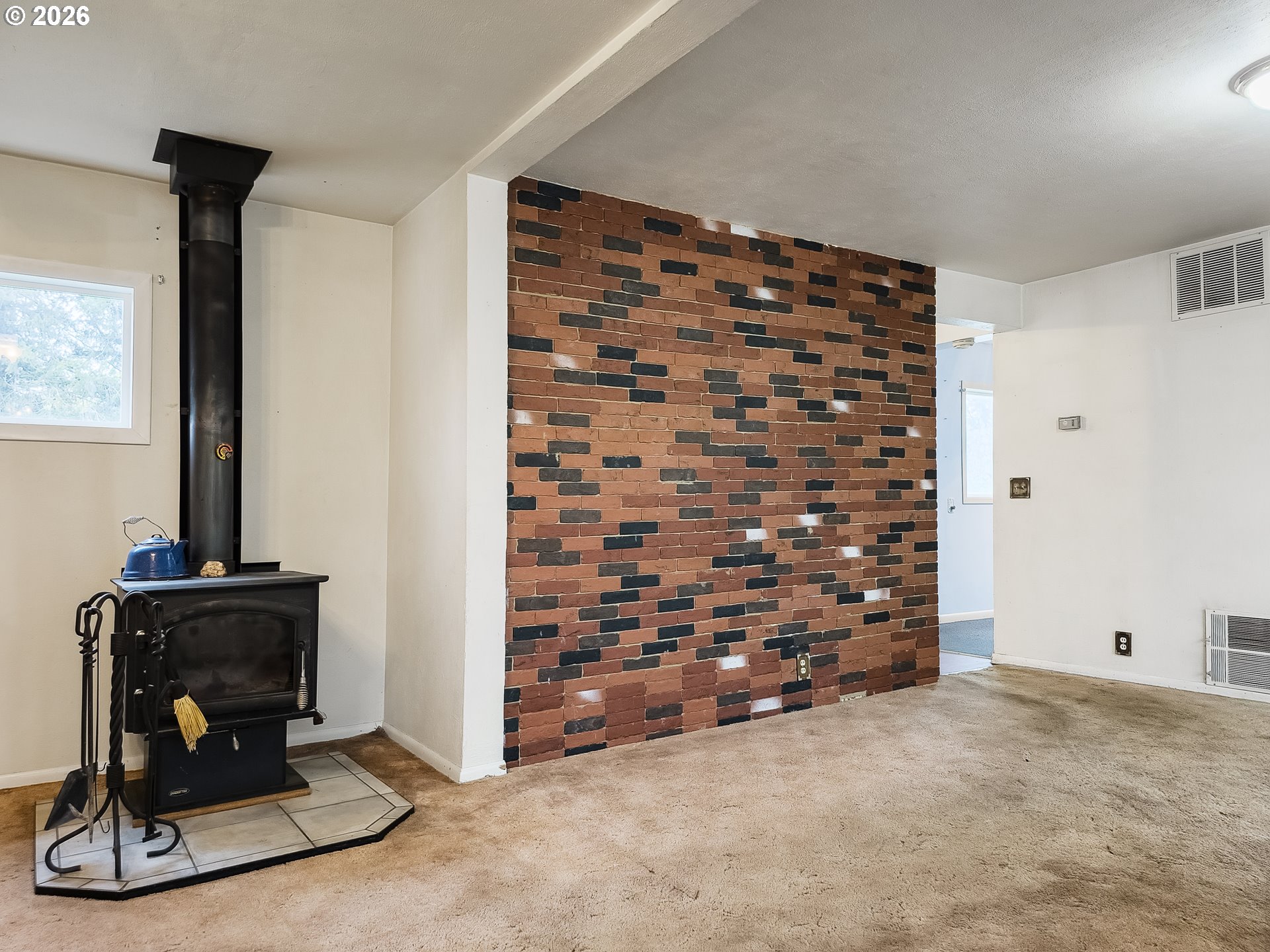 190 South 6th Street Elgin, OR 97827 - Photo 6 of 15 a view of empty room with fireplace