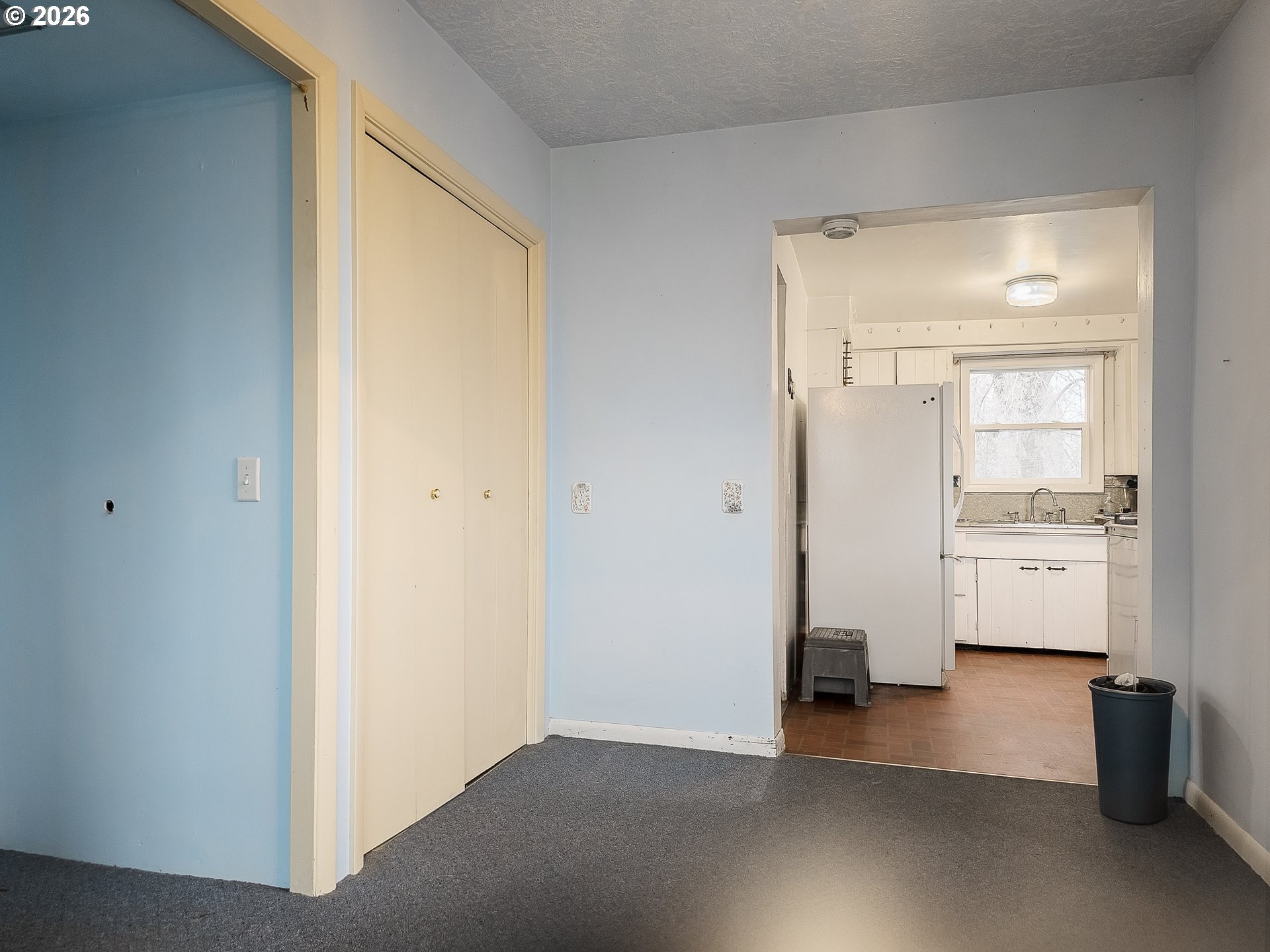 190 South 6th Street Elgin, OR 97827 - Photo 9 of 15 a view of an empty room and a kitchen