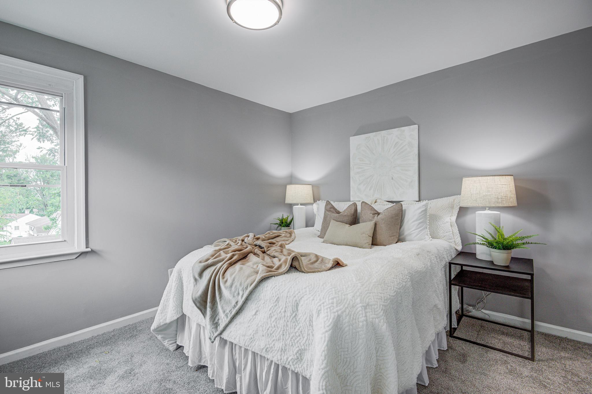 1852 Colmar Road Baltimore, MD 21207 - Photo 15 of 28 a bed room with a bed and a chair