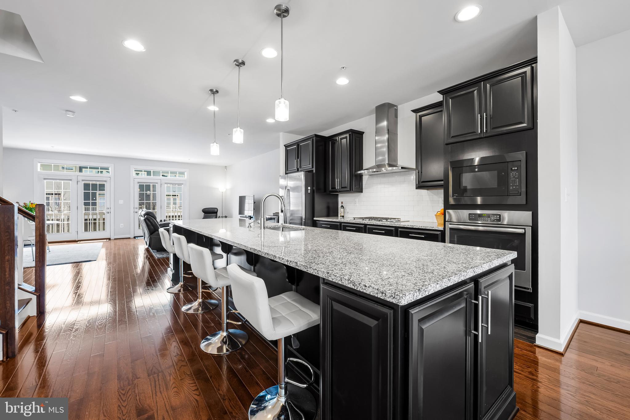 34 Wedge Way, Unit 10 Pikesville, MD 21208 - Photo 13 of 48 15 foot island with breakfast bar