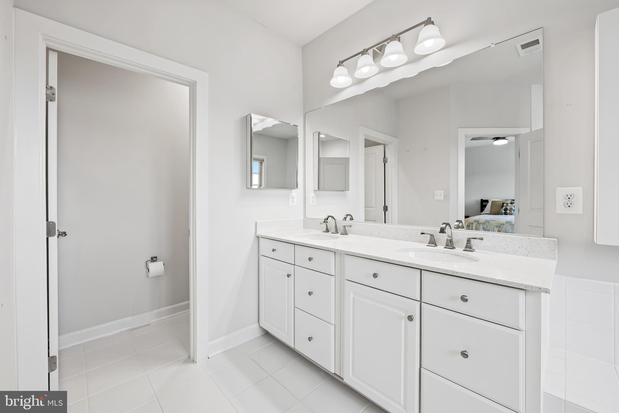 34 Wedge Way, Unit 10 Pikesville, MD 21208 - Photo 34 of 48 Water closet and double sinks