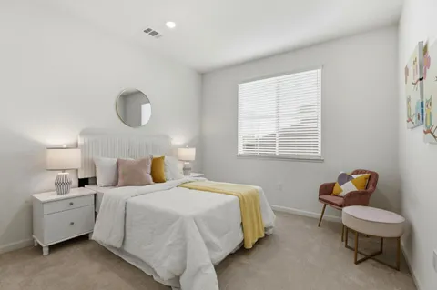 a bedroom with a bed and a closet