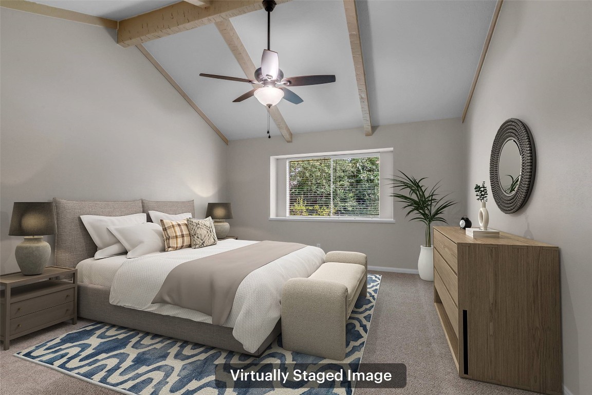 6415 Bayonne Drive Spring, TX 77389 - Photo 16 of 40 a bedroom with a bed and a chandelier