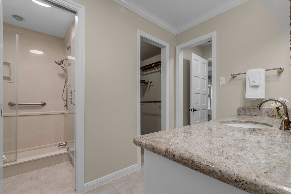 6415 Bayonne Drive Spring, TX 77389 - Photo 19 of 40 a bathroom with a granite countertop sink