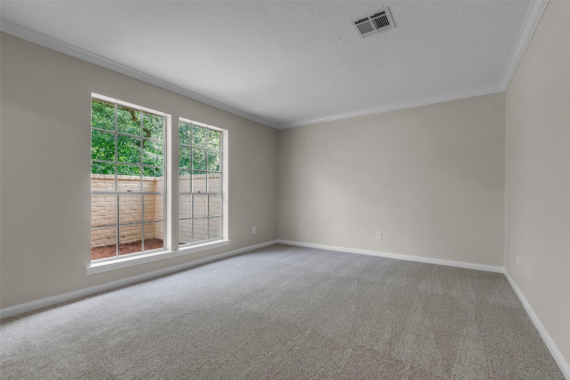 6415 Bayonne Drive Spring, TX 77389 - Photo 24 of 40 an empty room with wooden floor and windows