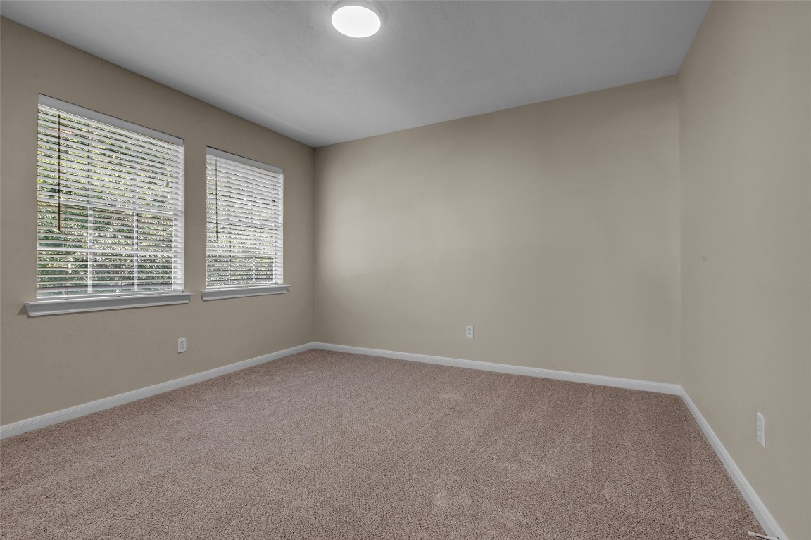 6415 Bayonne Drive Spring, TX 77389 - Photo 29 of 40 an empty room with windows
